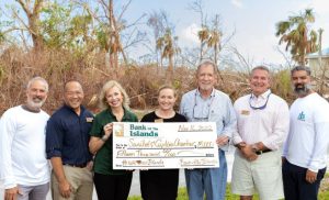 Gathered recently for the $15,000 check presentation from Bank of the Islands: San-Cap Chamber board member Mark Blust, Chamber CEO John Lai, Bank of the Islands President Robbie Roepstorff, Chamber President Calli Johnson, Bank CEO Geoff Roepstorff, and Chamber board members Ron Clayton and JR Ramirez.